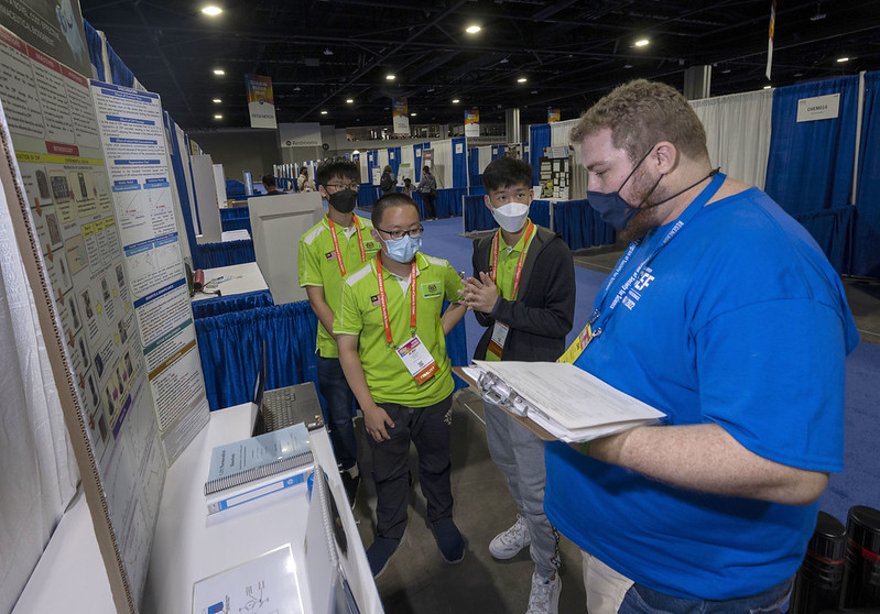 A Display and Safety volunteer conducts an initial inspection at Regeneron ISEF 2022
