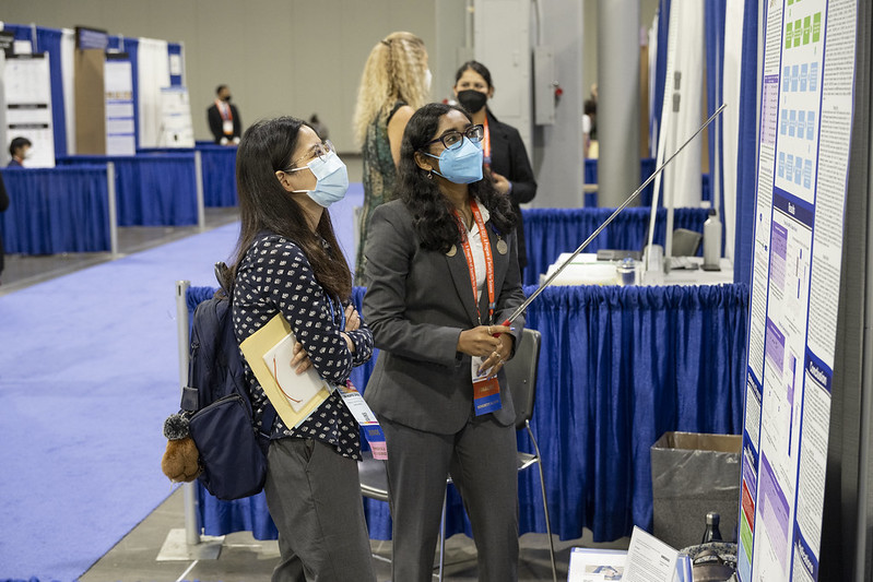 A finalist explains her project to a Grand Award Judge at Regeneron ISEF 2022.