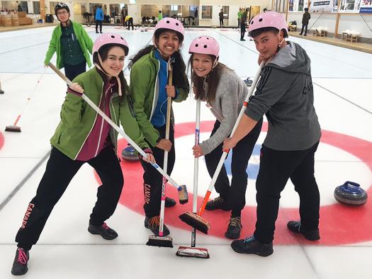 Dennis (right) went curling with the other young scientists.