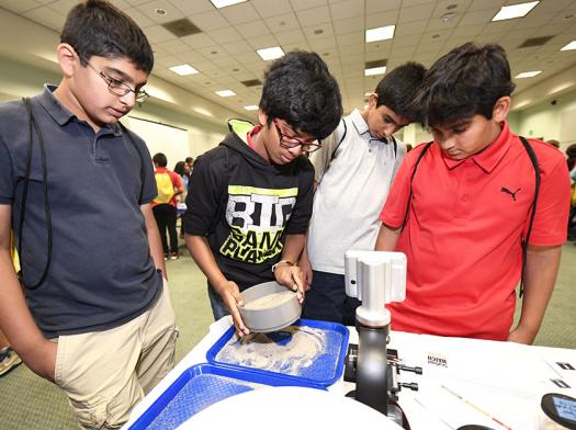 One of the STEM experiences at Intel ISEF 2017's Education Outreach Day focused on Mars rovers and how they take soil samples.