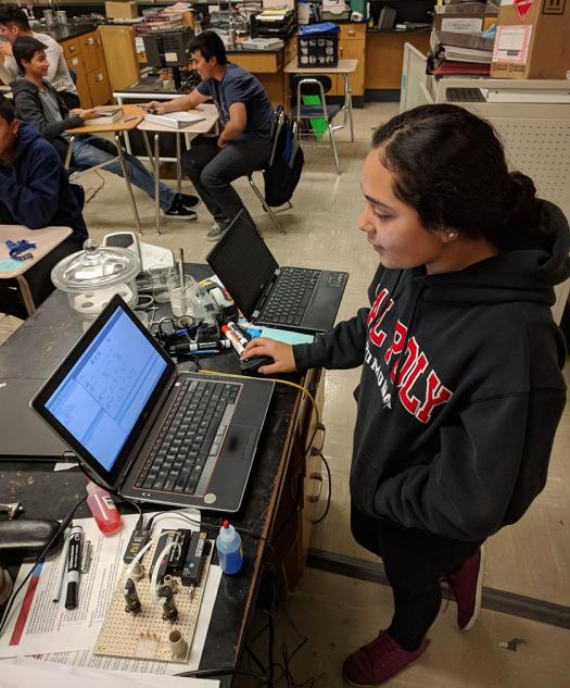 Lizbeth Martinez-Ramos works on a bio-microfluidic project at 7 a.m. She is learning how to write computer scripts.