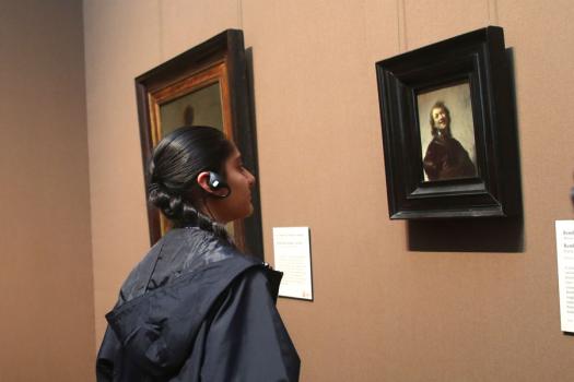 After learning about art conservation at the Getty Institute, Ashini Modi, from the U.S., examines a Rembrandt painting.