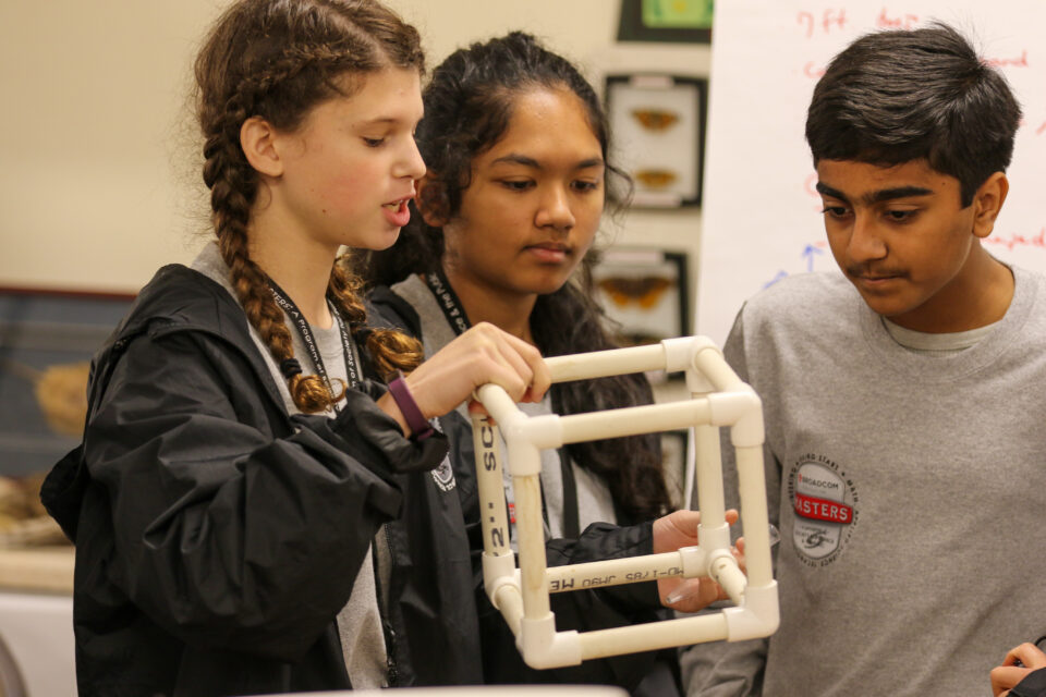 The silver team at Broadcom MASTERS 2019 works on their challenge at SERC.