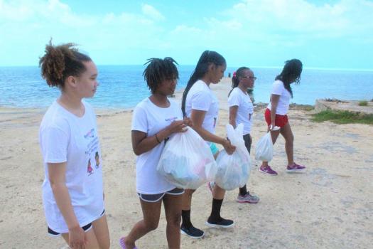 Black Girls Dive take part in ocean conservation efforts with a clean-up. 