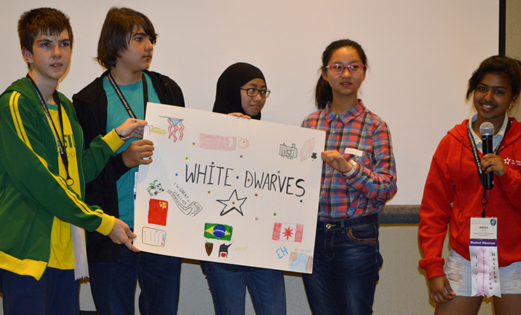 The white team described their poster at orientation.