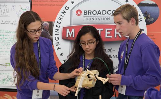 Aria Eppinger (left), Anushka Naiknaware, and Lucas Ritzdorf create a crab arm model.