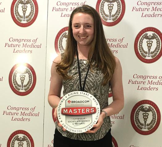 Hannah Cevasco holds up the Broadcom MASTERS logo.