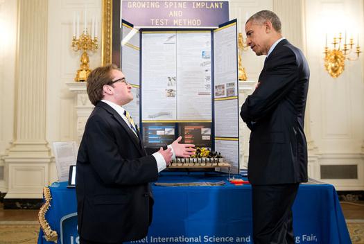 Intel ISEF 2014 first place winner Harry Paul discusses his research on spinal implants with President Obama.