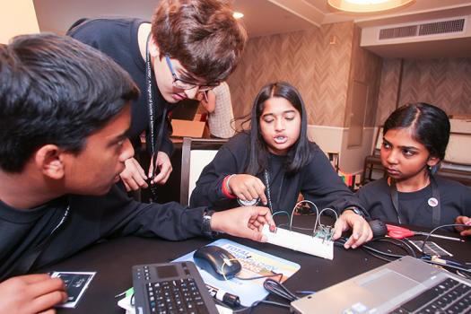 Ananya (middle) and her teammates work on a Raspberry Pi challenge.