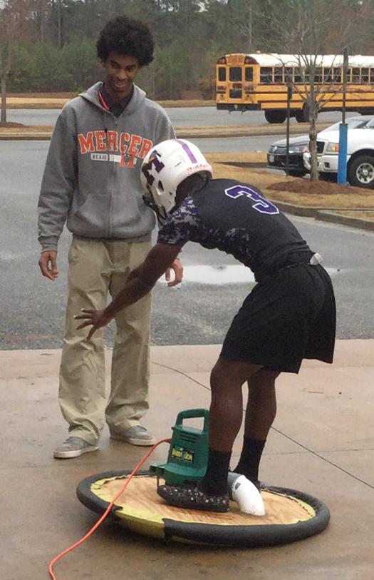 Students work on their hovercraft project.