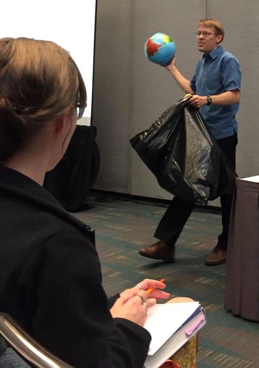 Mark Petersen passed out globes to explain what climate change researchers study.