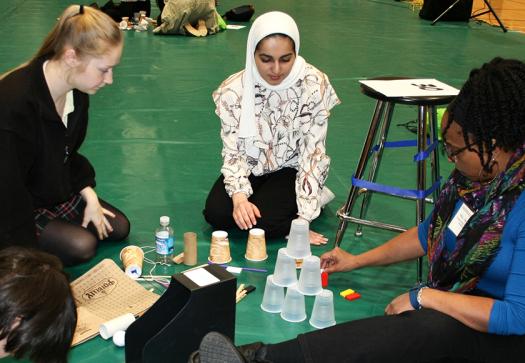 Students engineered designs to raise flags using trash.