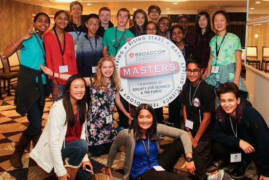 The 2016 finalists hold up the Broadcom MASTERS logo.