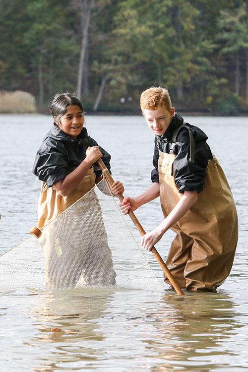 Ananya Ganesh and Brendan Crotty waded into the Chesapeake Bay to caught wildlife in large nets, called seining.