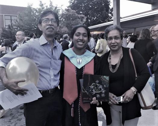Indrani with her parents at her high school graduation