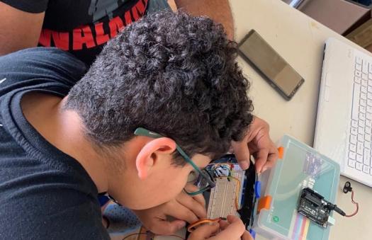 Izal working on his echolocation glasses