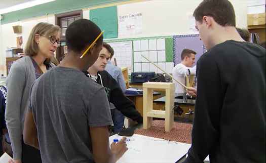 Janet Waldeck, left, watches as students participate in a lab using a lending kit.