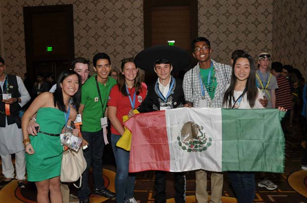 Julie (center) meets students from around the world at the Intel ISEF 2014 Pin Exchange