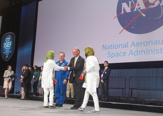 Intel ISEF 2016 finalists receive an award from NASA onstage.