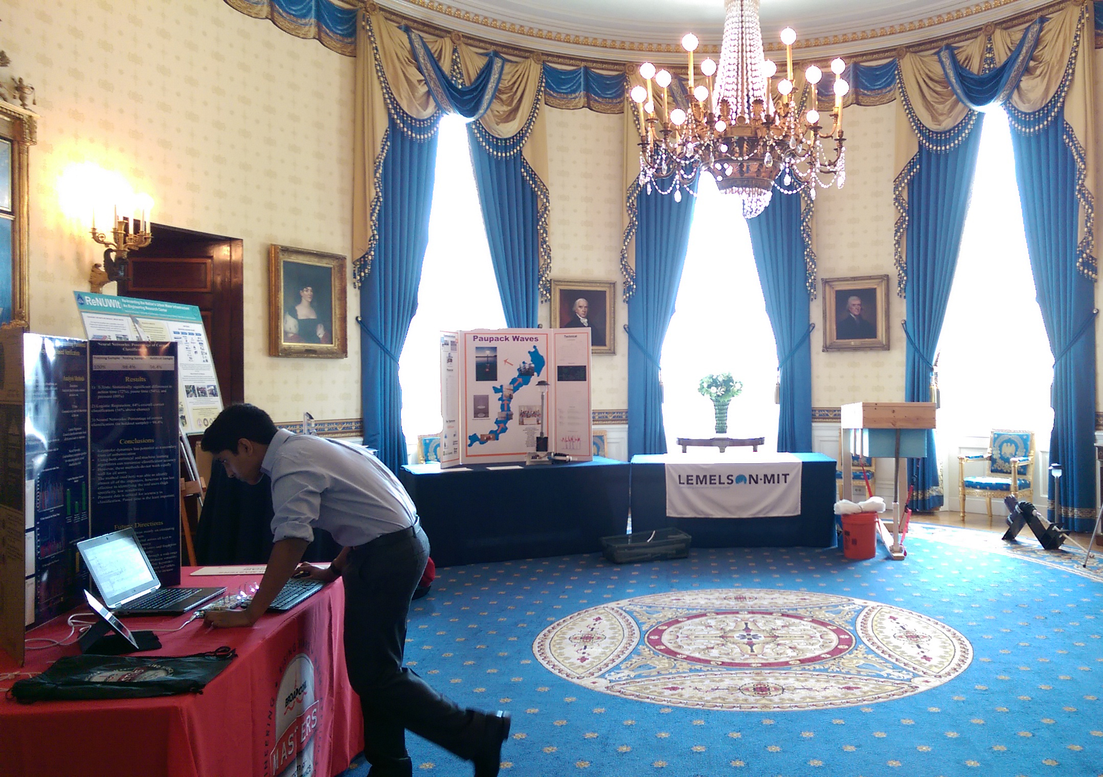 Nikhil Behari, Broadcom MASTERS 2014 finalist, sets up his project in The Blue Room of the White House. 