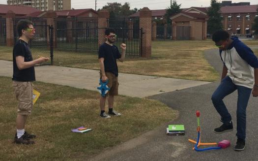 Students put lessons to use in a hands-on science activity. 