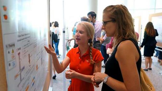 Sara presenting her research at a Scripps science fair.