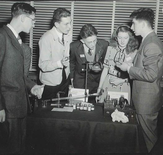 Andrew Sessler (right) and other finalists discuss their hobbies.