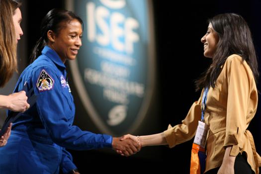 American astronaut Jeanette J. Epps congratulates Naomi as she receives a NASA Special Award at Intel ISEF 2012.