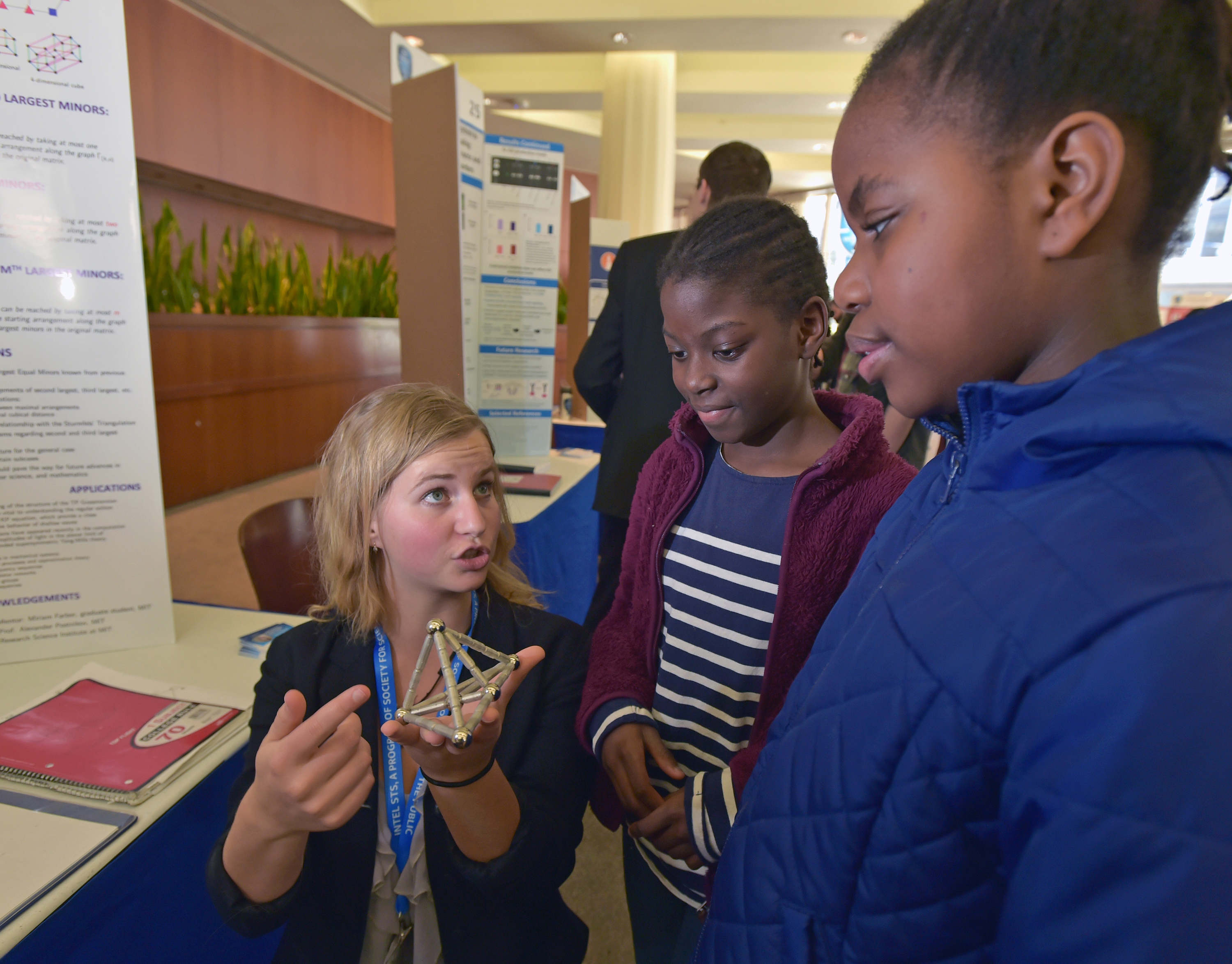 Yelena Mandelshtam of Irvine, California explains her math project about totally positive matrices. Yelena Mandelshtam of Irvine, California explains her math project about totally positive matrices.