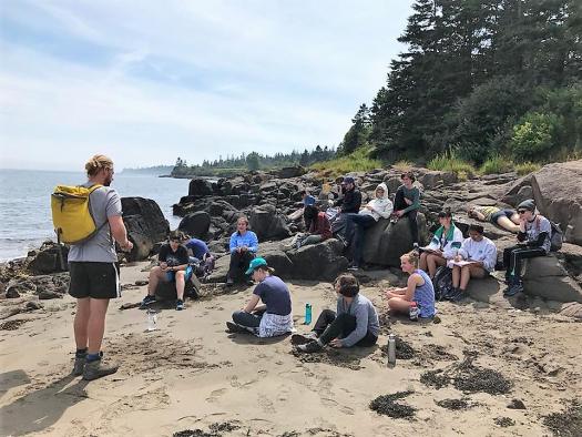 The Whale Camp attendees listen intently