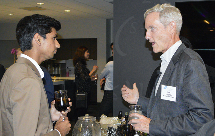 Akamai CEO and event host Tom Leighton (right) talks to STS 2015 alumnus Eswar Anandapadmanaban