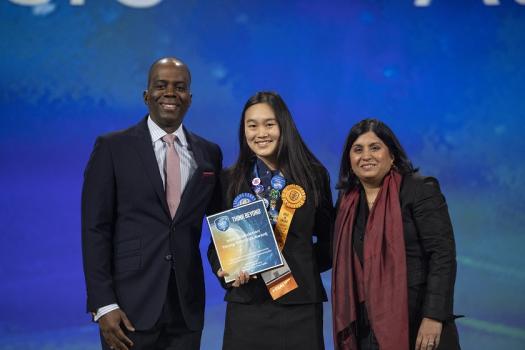 Allison standing with Society CEO and Managing Director of Intel Corp.