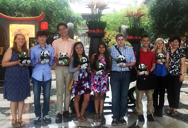 Intel ISEF finalists hold pandas in China.