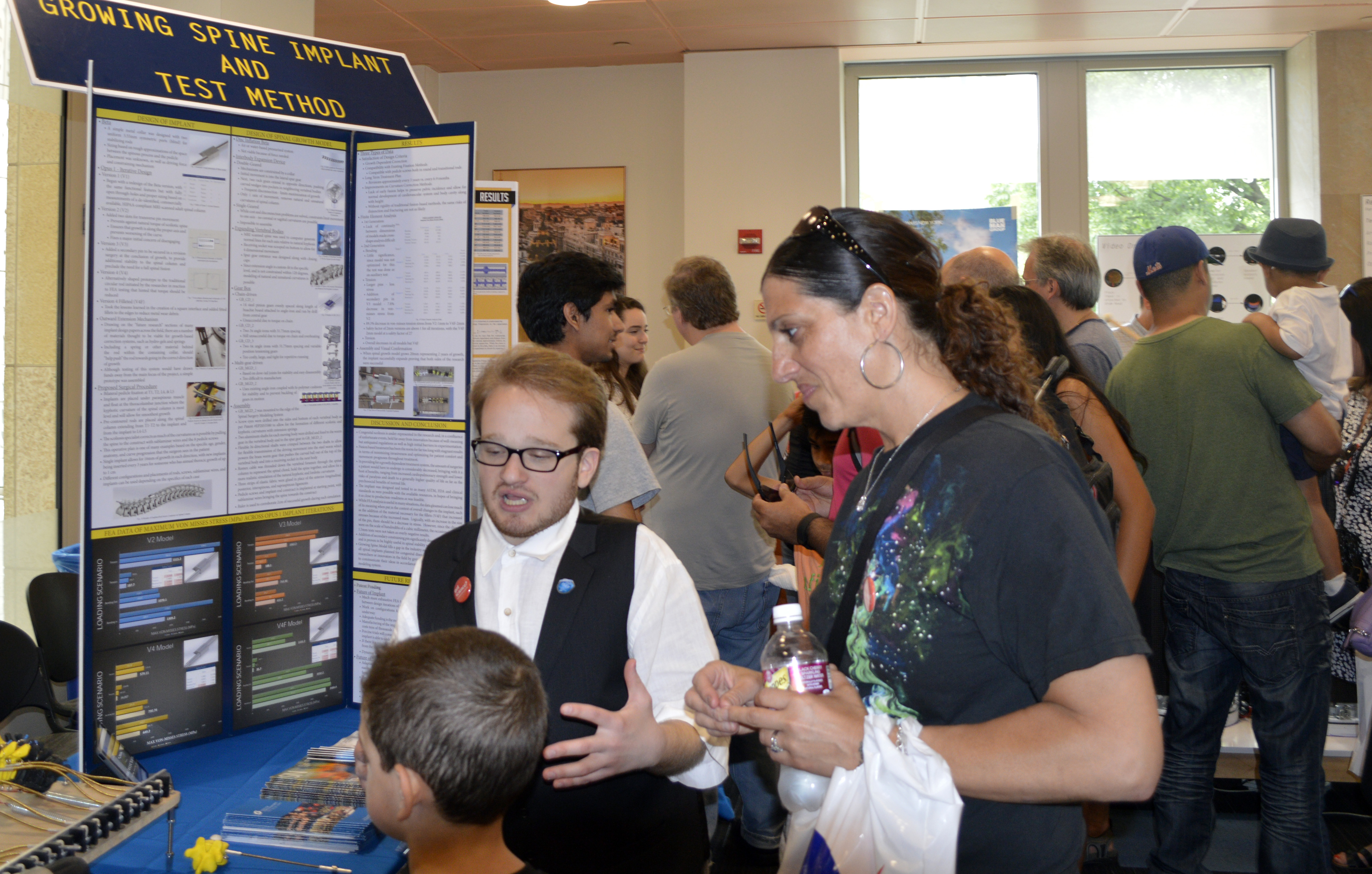 Harry Paul sharing his development of a device made to straighten spines of children with scoliosis with visitors at the Fair.