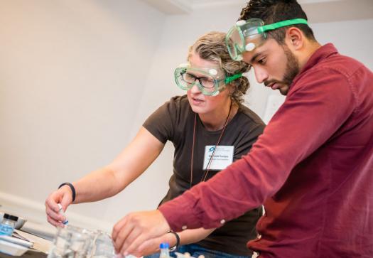 Ellen Smith Tourigny and Elias Arellano Villanueva work on a project at the Advocate Training Institute in Washington, D.C.