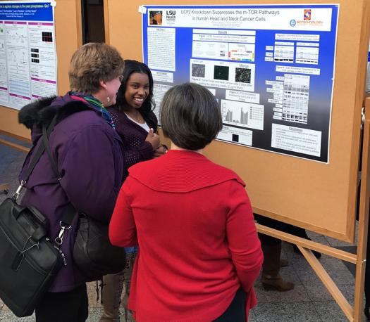 Kearra explains her project to the public at her science fair.