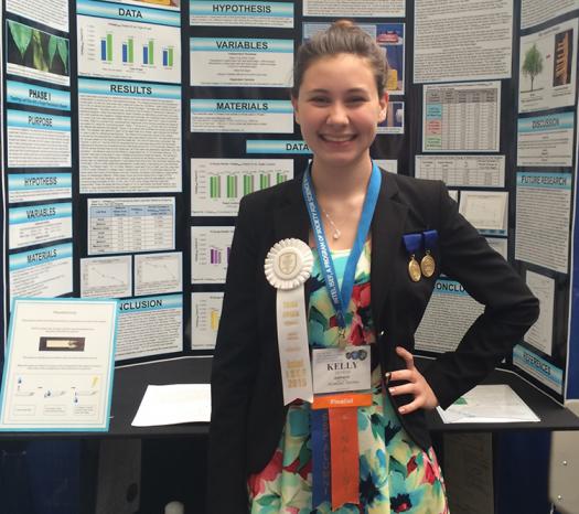 Kelly stands by her Intel ISEF 2015 project. Photo courtesy of Kelly Devens.