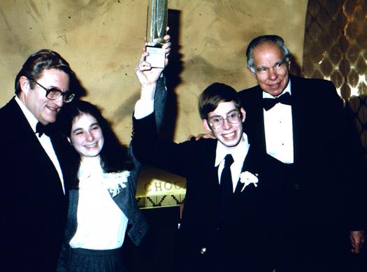 E.G. Sherburne of Science Service, second place winner Lisa Randall, first place winner John Andersland, and Nobel Laureate Glenn Seaborg at Intel STS 1980.