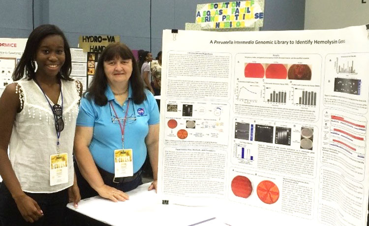 Society Advocate Pat Monteith with one of her students, Chelsey Skeete, who recently won first place in a science competition.