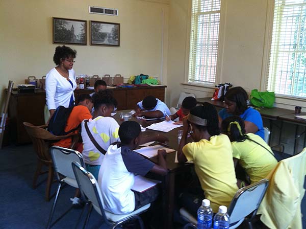 Elementary and middle school students work on science fair projects.