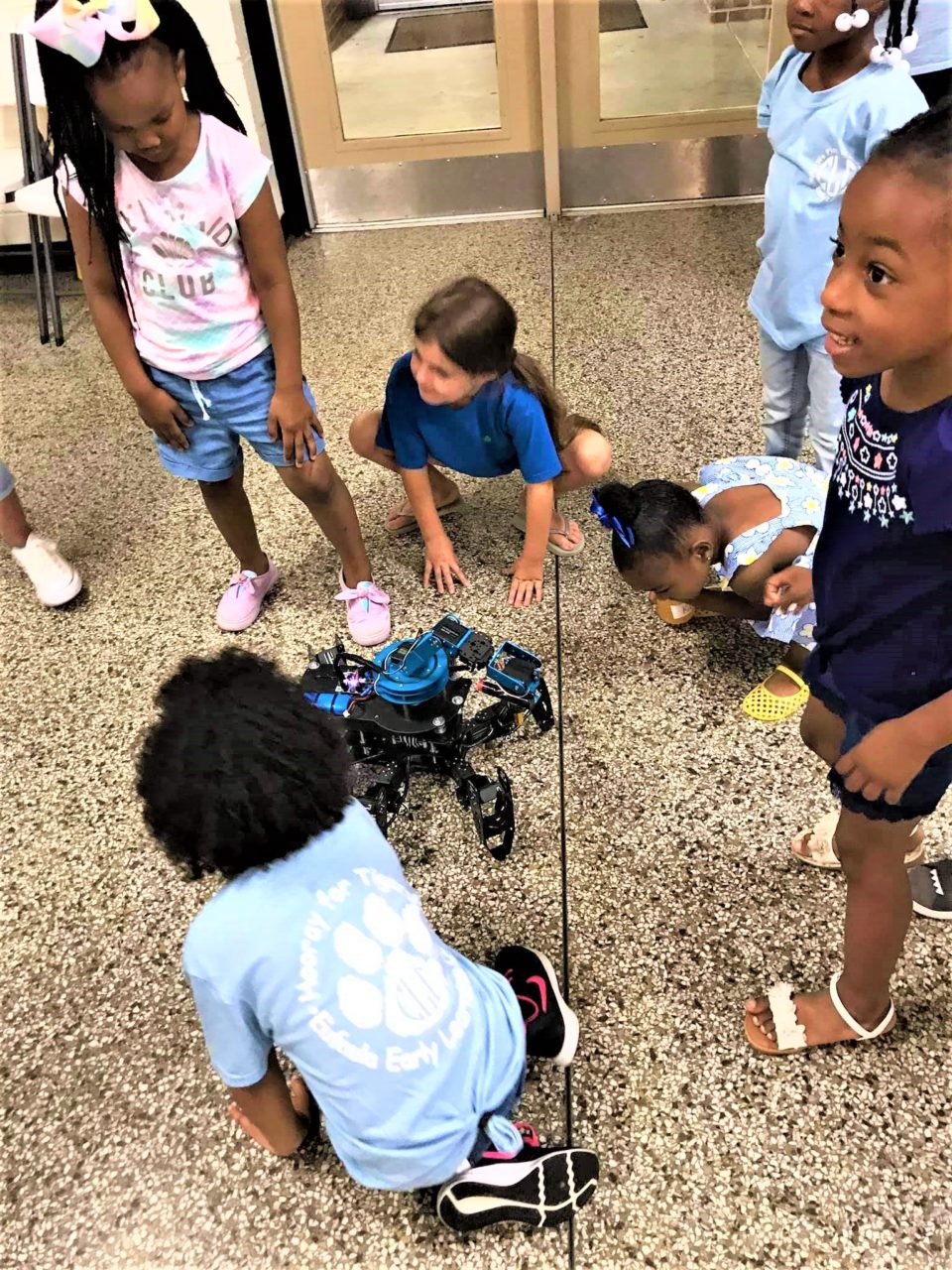 Young students admire ELECTRA.