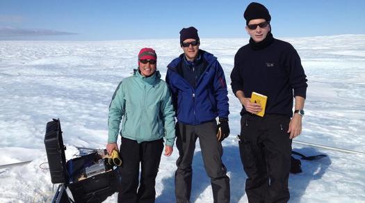 Twila Moon (left) in the field checking science instruments near the west coast of the Greenland Ice Sheet.