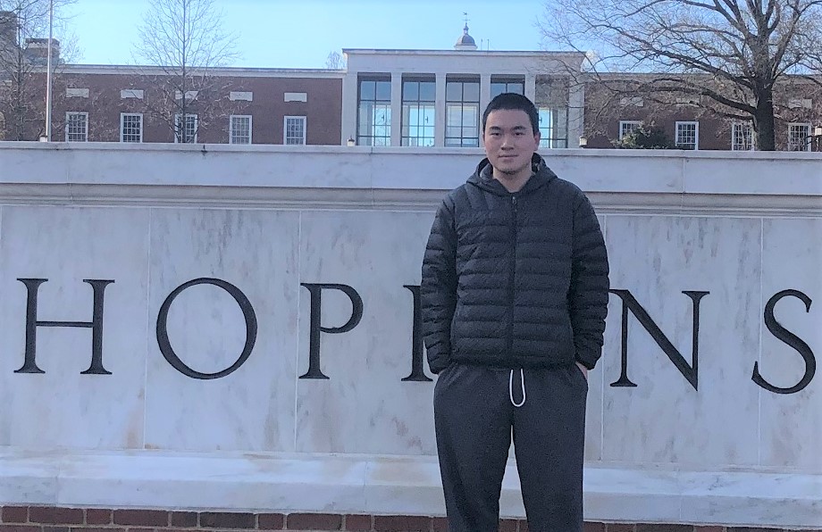 alum Nathan Wang pictured in front of JHU