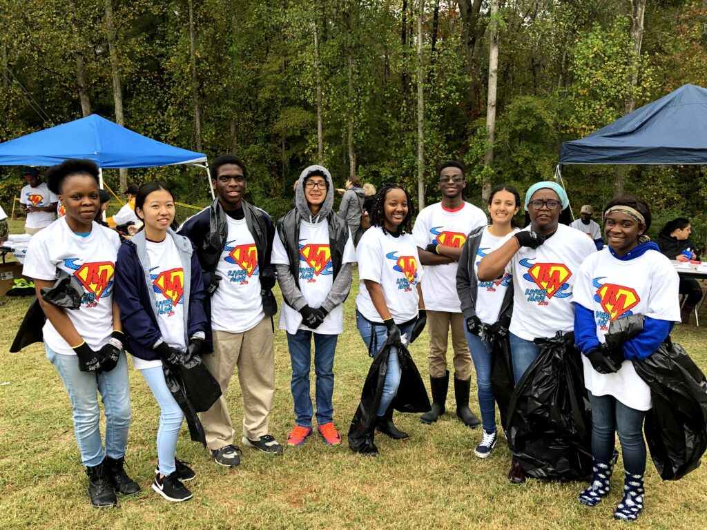 Hutchins-Trapp and some of her students outdoors at a community service event.