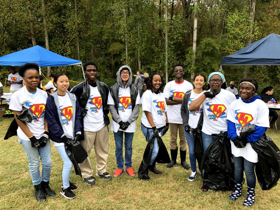 Hutchins-Trapp and some of her students outdoors at a community service event.