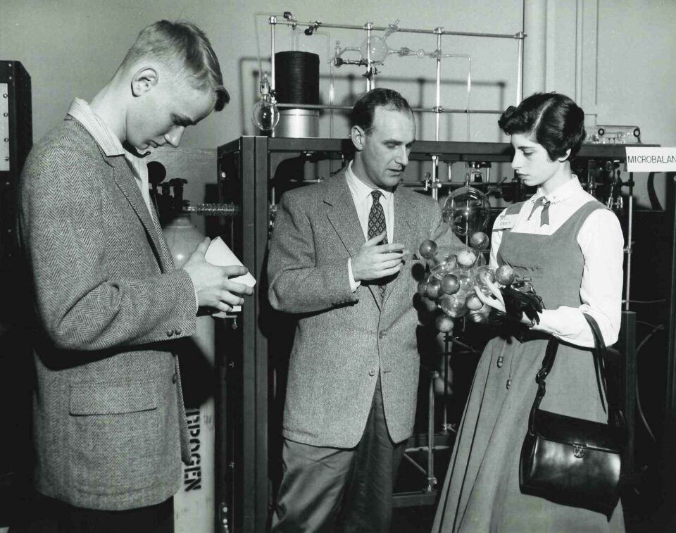 Susan Kayser studying a molecular model during the 1956 STS.