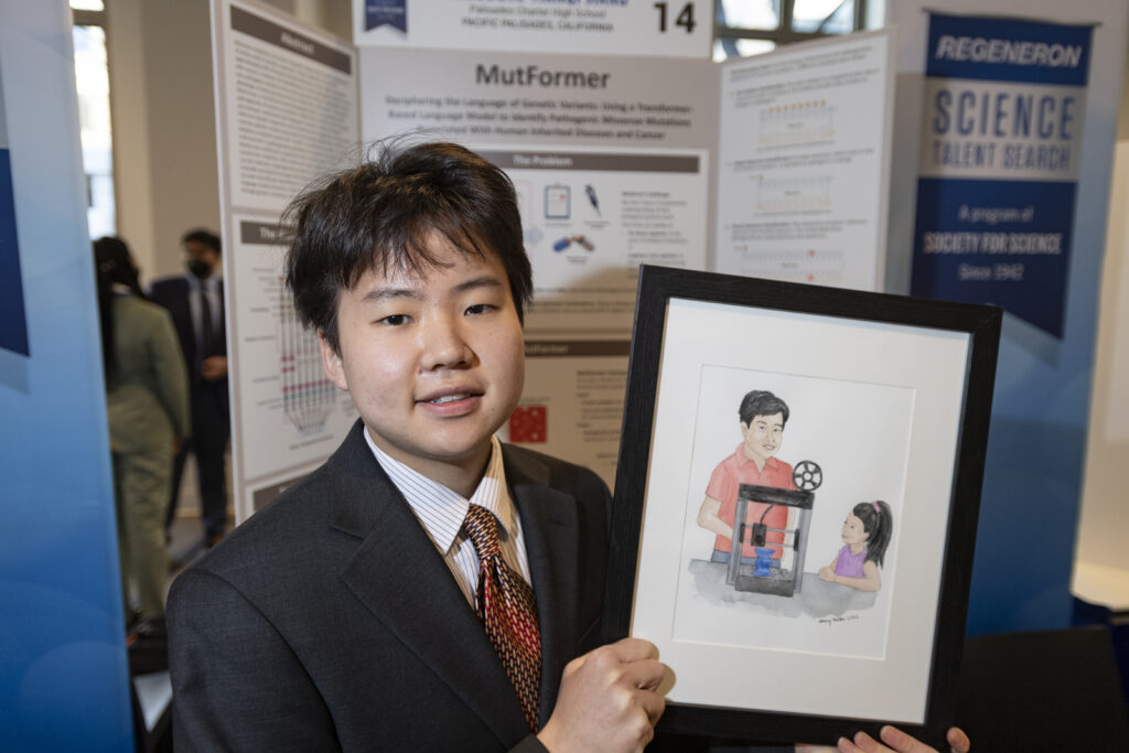 Theo Jiang poses with his self portrait during Public Day