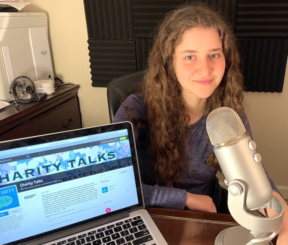 Brooke Dunefsky is seen with her podcasting microphone and laptop