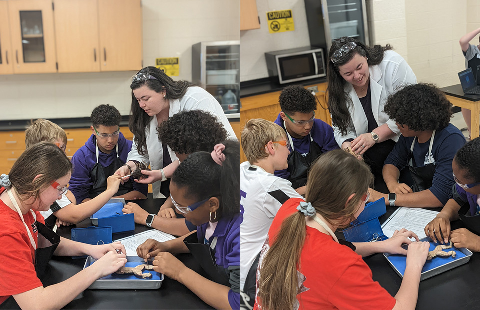 Lead Advocate ScottiAnn Benton guides a group of students during a biology lesson.