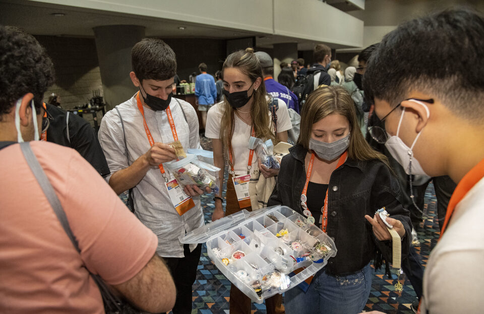 Finalists exchange pins from their home countries and states during the 2022 Regeneron ISEF Pin Exchange